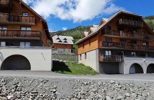 Pra Loup Apartment | Large Studio for 4 with Mountain Style, Balcony, and Scenic Views in Pra Loup